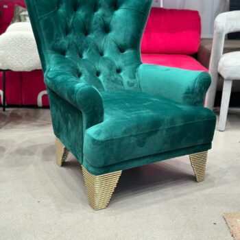 Fauteuil capitonnée en velours vert